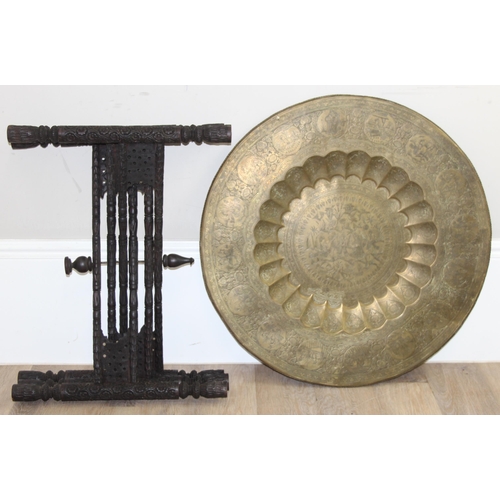 163 - A vintage brass topped folding Benares tray topped table, approx 75cm in diameter x 54cm tall