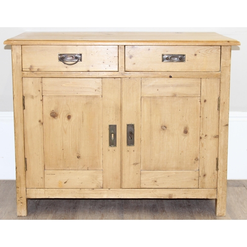 8 - An antique stripped pine cupboard or sideboard with 2 drawers over a 2 door cupboard, with black pai... 