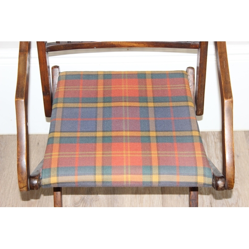 99 - An antique folding mahogany campaign chair with later tartan upholstery, approx 51cm wide x 102cm ta... 