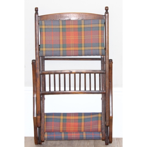 99 - An antique folding mahogany campaign chair with later tartan upholstery, approx 51cm wide x 102cm ta... 