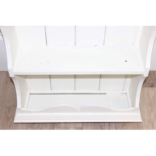 113 - A vintage white painted towel rail and a white painted pine wall shelf, the towel rail approx 72cm w... 