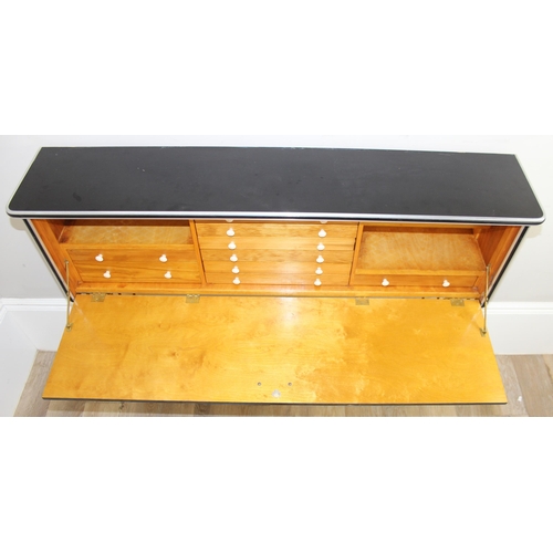 32 - An unusual retro desk type sideboard with black Formica top and metal hairpin legs, fold down front ... 