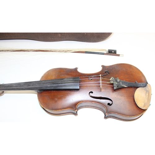 728 - A vintage violin and bow in case, both the violin and bow seemingly unmarked, approx 60cm in total l... 