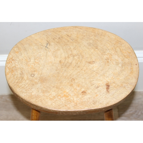 115 - A rustic style light elm stool made by Chris Preston & a further vintage oval topped lightwood stool... 