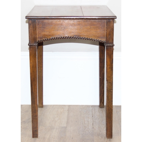 31 - An Edwardian Sheraton style mahogany side table with transfer printed roundel to top and rope twist ... 