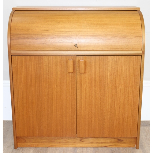 29 - A retro Swedish drum topped bureau by SMI (Sveriges Möbelindustriförbund), the roll top housing a nu... 