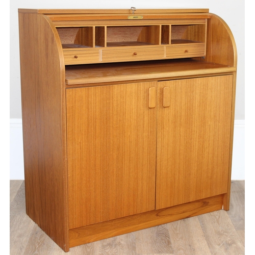 29 - A retro Swedish drum topped bureau by SMI (Sveriges Möbelindustriförbund), the roll top housing a nu... 