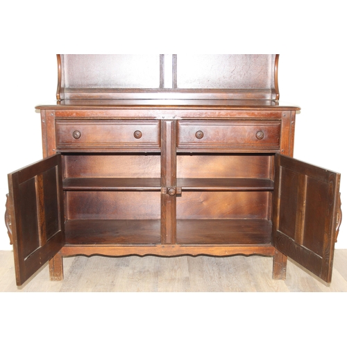 58 - A vintage oak dresser or sideboard, likely Ercol or Old Charm but seemingly unmarked, approx 123cm w... 