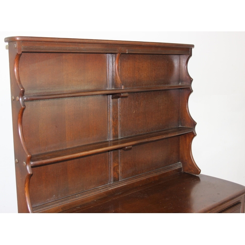 58 - A vintage oak dresser or sideboard, likely Ercol or Old Charm but seemingly unmarked, approx 123cm w... 