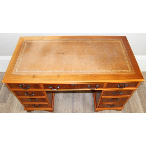 30 - A modern Yew wood effect oak pedestal 3 part desk with inset leather top, approx 122cm wide x 61cm d... 