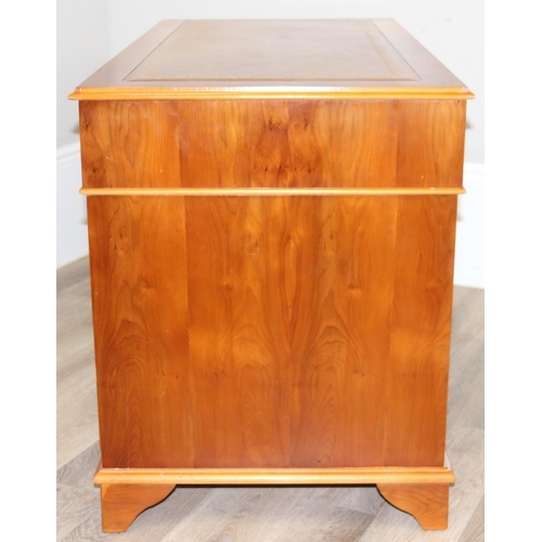 30 - A modern Yew wood effect oak pedestal 3 part desk with inset leather top, approx 122cm wide x 61cm d... 