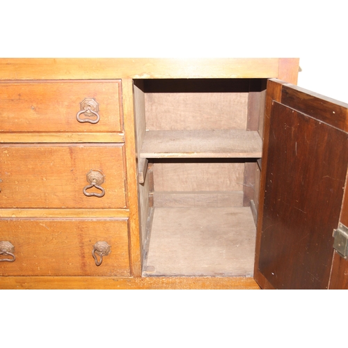 111 - A vintage oak sideboard with 3 drawers flanked by 2 cupboards, early 20th century, approx 121cm wide... 