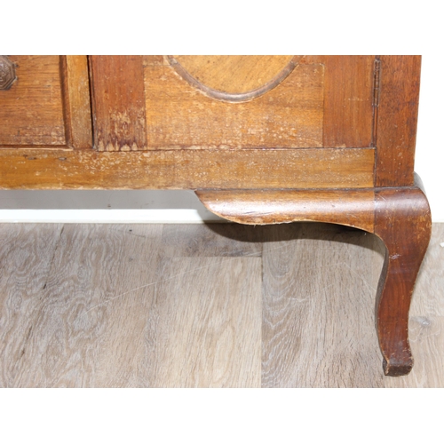 111 - A vintage oak sideboard with 3 drawers flanked by 2 cupboards, early 20th century, approx 121cm wide... 