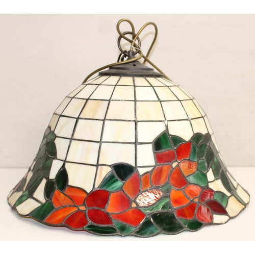 255 - A large Tiffany style leaded glass lamp shade decorated with red flowers, approx 48cm wide