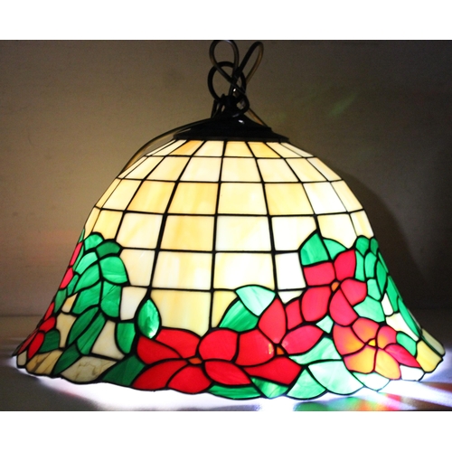 255 - A large Tiffany style leaded glass lamp shade decorated with red flowers, approx 48cm wide