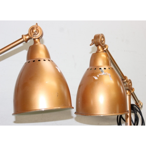 257 - A pair of gold painted industrial style Anglepoise type desk lamps, approx 54cm tall in pictured set... 