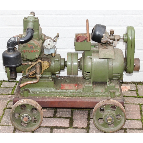 302 - A vintage Stuart Turner R2Y engine mounted on trolley with control panel and light board, on iron wh... 