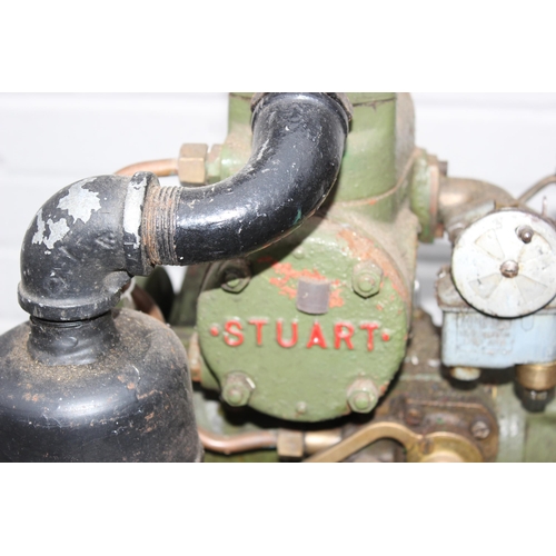 302 - A vintage Stuart Turner R2Y engine mounted on trolley with control panel and light board, on iron wh... 