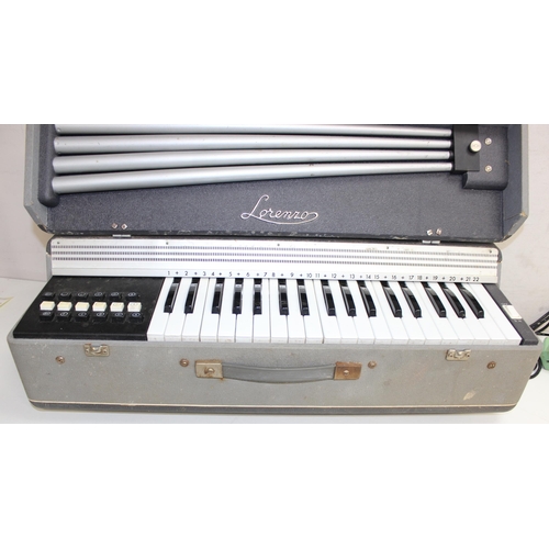 734 - Vintage Lorenzo organ/keyboard in carry case and a Hohner harmonica