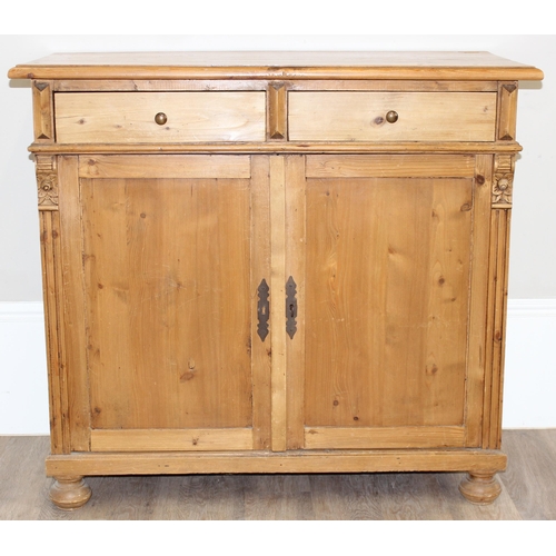 10 - A vintage pine 2 drawer and 2 door sideboard with carved pillar sides, approx 109cm wide x 51cm x 10... 