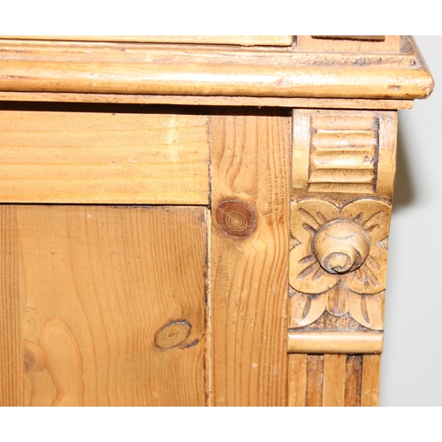 10 - A vintage pine 2 drawer and 2 door sideboard with carved pillar sides, approx 109cm wide x 51cm x 10... 