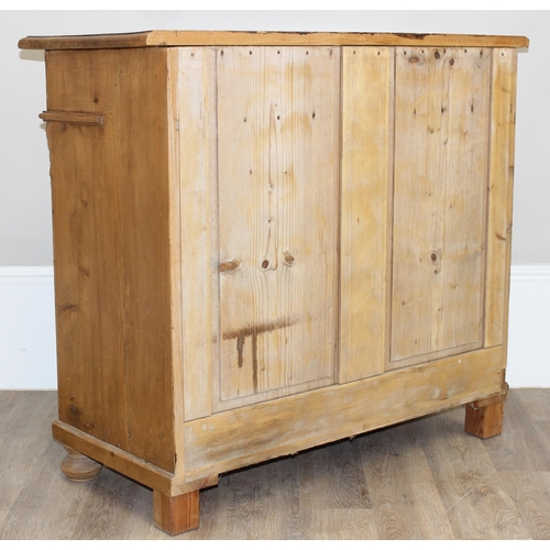 10 - A vintage pine 2 drawer and 2 door sideboard with carved pillar sides, approx 109cm wide x 51cm x 10... 