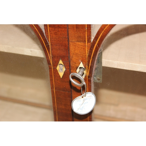 64 - An unusual antique mahogany wall-mountable Gothic style glazed cabinet with three drawers and inlaid... 