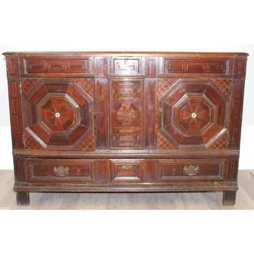 19 - An extremely unusual antique cupboard with single drawer to base and geometric parquetry design, bel... 