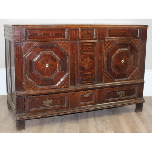 19 - An extremely unusual antique cupboard with single drawer to base and geometric parquetry design, bel... 