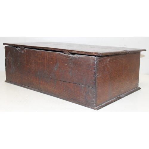 279 - An antique oak bible box with carved details and iron lock and hinges, carved details include the in... 