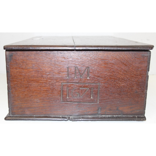 279 - An antique oak bible box with carved details and iron lock and hinges, carved details include the in... 