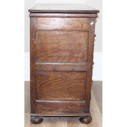 16 - A William & Mary period late 17th century oak 4 drawer chest of drawers with bun feet, later replace... 