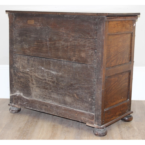 16 - A William & Mary period late 17th century oak 4 drawer chest of drawers with bun feet, later replace... 