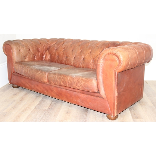 38 - A vintage brown leather Chesterfield button back sofa, 2 seater, approx 204cm wide x 96cm x 75cm tal... 