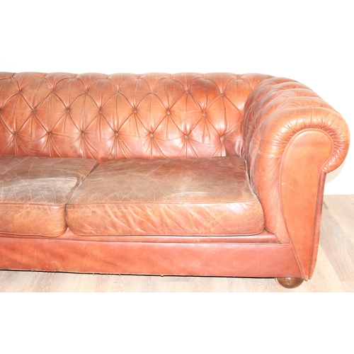 38 - A vintage brown leather Chesterfield button back sofa, 2 seater, approx 204cm wide x 96cm x 75cm tal... 