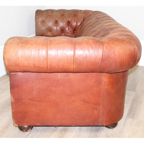 38 - A vintage brown leather Chesterfield button back sofa, 2 seater, approx 204cm wide x 96cm x 75cm tal... 