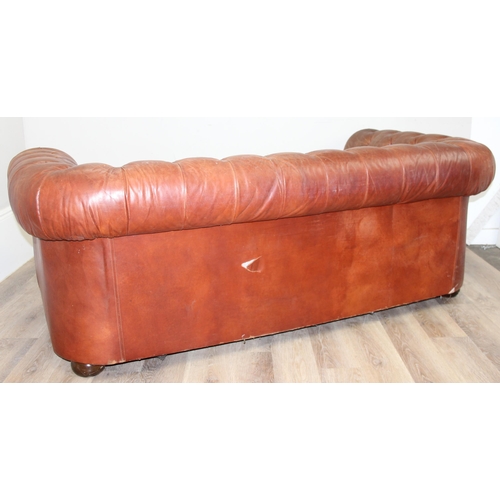 38 - A vintage brown leather Chesterfield button back sofa, 2 seater, approx 204cm wide x 96cm x 75cm tal... 