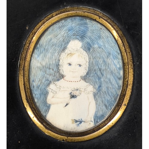 423 - An early 19th century portrait miniature depicting a young girl with flowers, seemingly unsigned, va... 