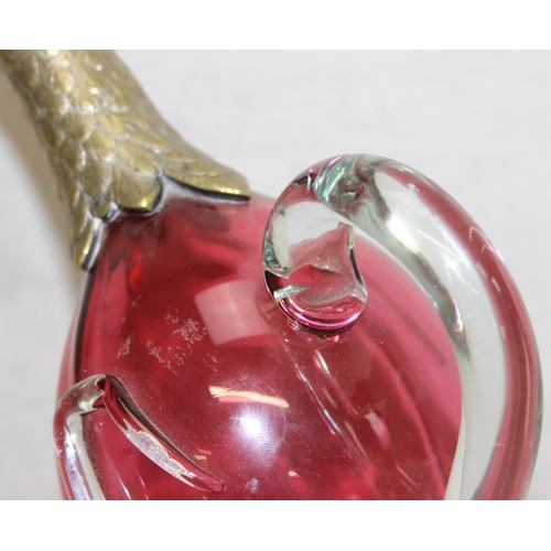 1058 - A rare cranberry glass and silver plate mounted decanter or claret jug formed as a duck, the feet ma... 