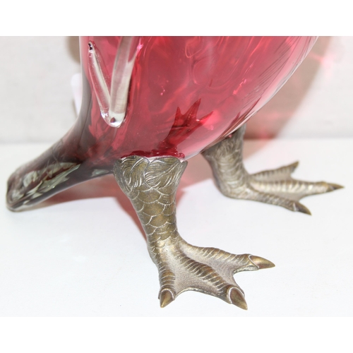 1058 - A rare cranberry glass and silver plate mounted decanter or claret jug formed as a duck, the feet ma... 