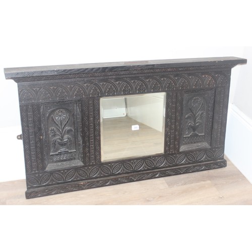 433 - A 19th century Gothic Revival carved oak over-mantel or wall mirror, a projecting cornice over friez... 