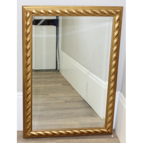 413 - An antique style gilt framed mirror with rope twist style decoration, approx 106cm x 75cm