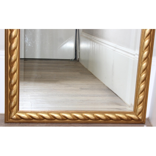 413 - An antique style gilt framed mirror with rope twist style decoration, approx 106cm x 75cm