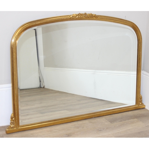 417 - An antique style gilt framed overmantel mirror, approx 142cm x 93cm