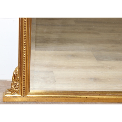 417 - An antique style gilt framed overmantel mirror, approx 142cm x 93cm