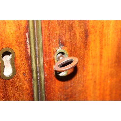 65 - A 19th century mahogany linen press converted wardrobe with 2 over 2 chest of drawers base and turne... 