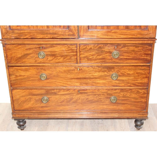 65 - A 19th century mahogany linen press converted wardrobe with 2 over 2 chest of drawers base and turne... 