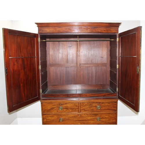 65 - A 19th century mahogany linen press converted wardrobe with 2 over 2 chest of drawers base and turne... 