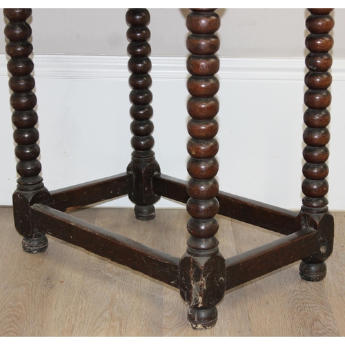 15 - A rare oak side table with bobbin-turned legs and peg construction, believed to be Charles II period... 