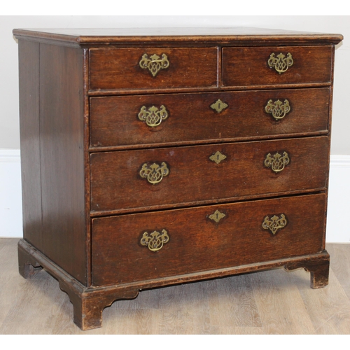 13 - A Georgian oak 2-over-3 oak chest of drawers with decorative brass fittings and bracket feet, approx... 